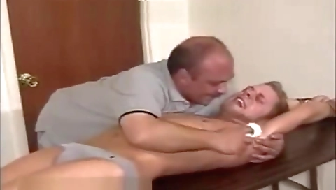 Sexy coupl offended in the kitchen